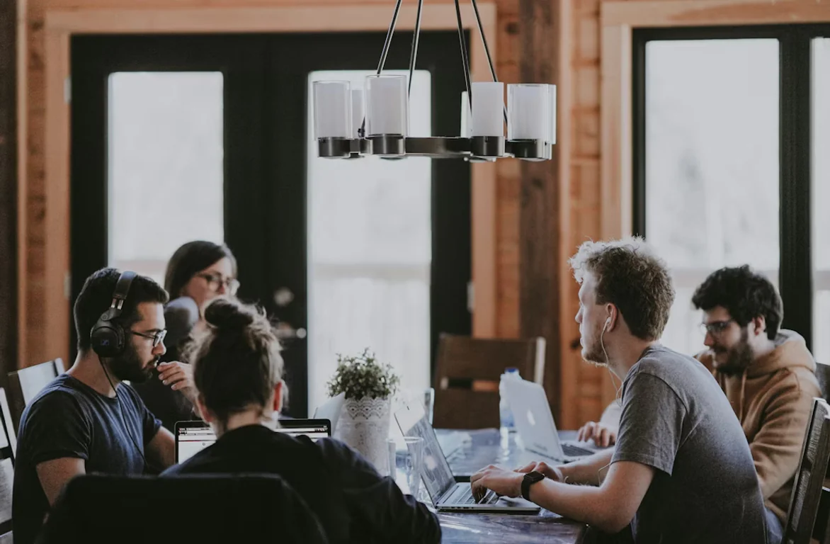 A technology finance team working together in an open-plan office